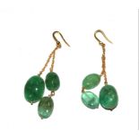 A pair of polished emerald earrings