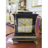 A George II style ebonised and gilt-metal bracket clock, the matted brass dial with scroll spandrels