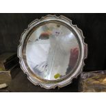 A silver circular tray with pie crust edge, Sheffield 1964, 28 cm diameter