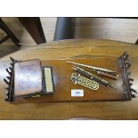 A Victorian walnut bookstand, with low hinged fret carved ends, 38.5 cm wide, a desk top inlaid