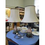 A pair of Moorcroft Pottery waisted table lamps, Cluny patterm, on turned wood bases, 34 cm high