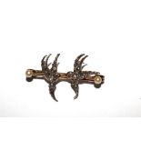 A bar brooch with two diamond set swallows together with a costume brooch in the form of an