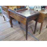 A mahogany foldover tea table, with a drop leaf to the front, covering a frieze drawer, on square