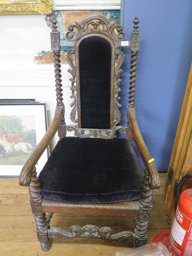 A Victorian Carolean style carved oak carver chair, with barley-twist supports