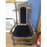A Victorian Carolean style carved oak carver chair, with barley-twist supports