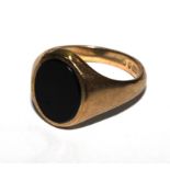 A 9 carat gold signet ring with black onyx stone