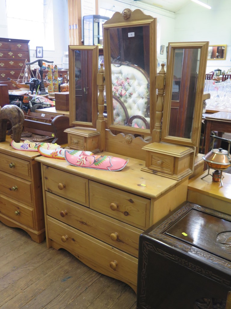 A pine dressing table, with triptych mirror and trinket drawers, over two short and two long