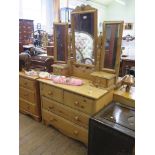 A pine dressing table, with triptych mirror and trinket drawers, over two short and two long