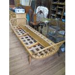 An Ercol light elm and beech day bed, frame and back only, (lacking bolts for the back), 207 cm wide