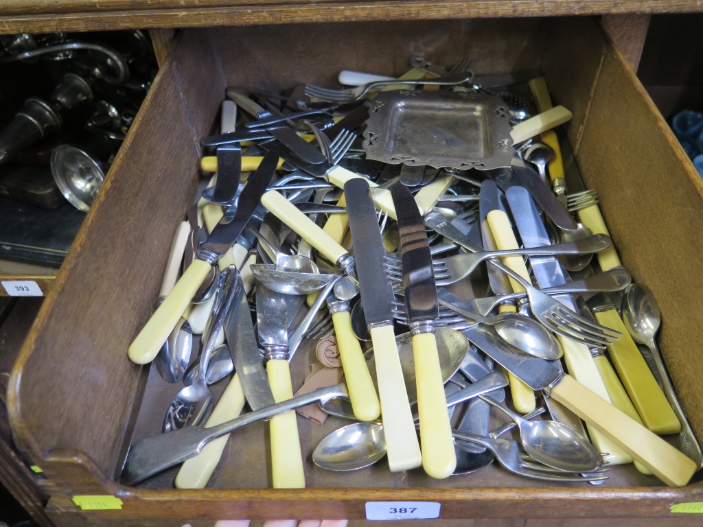 A collection of silver plate and bone handled cutlery