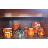 Seven Poole Pottery Delphis range vases, highest 16 cm, and a Poole Pottery figure of a dolphin