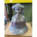 An Art Nouveau bronzed finish bust of a young woman with intricate metal detailing and faux gems,