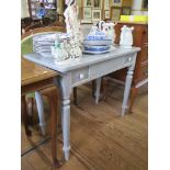 A Victorian style painted side table, with two small frieze drawers, on turned legs, 90 cm wide, and