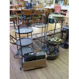 A copper and wrought iron three tier cake stand, another three tier stand, a brass table, a copper