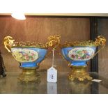A pair of Sevres giltmetal mounted bowls, with panels of floral decoration within turquoise grounds,