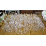 Various sherry glasses and decanters, most etched with fern design, a pair of glass dishes, and