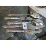 Five pieces of plated cutlery with silver handles to include cake slice, bread knife, cheese