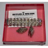 A stone set bracelet together with a pair of matching earrings by Butler & Wilson in original box