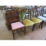 A pair of Edwardian stained wood and ivorine inlaid salon chairs, the carved backs inlaid with