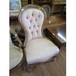 A Victorian walnut nursing chair, the cabochon carved button back on moulded cabriole legs and pot