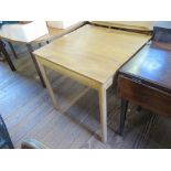 An Ercol light elm and beech tea trolley, and an Ercol light elm and beech square side table, 69