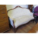 A 19th century continental two seat settee, the serpentine back and arms on cabriole legs with pot