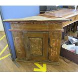 A Continental pine corner cabinet, possibly Swiss, the panelled door painted with floral motifs,