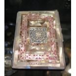 A vintage 1950s Sylva Emu brand chrome cigarette case with applied intricate mother of pearl and