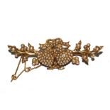 A seed pearl brooch with two entwined hearts with a diamond to both heart centres, set in gold