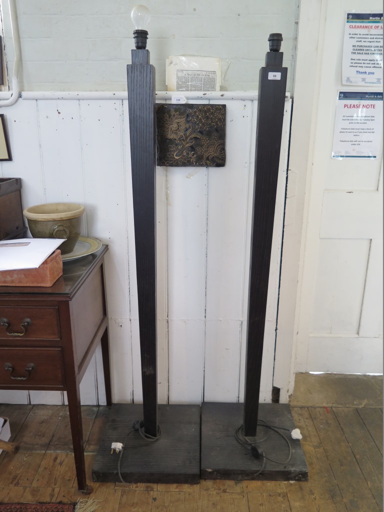 A pair of black standard lamps, with square tapering stems and square bases, 151 cm high