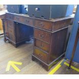 A reproduction mahogany pedestal desk, the freize drawers over pedestals each with three drawers,