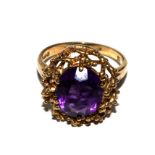 A 9 carat gold ring with amethyst