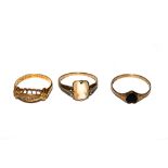 A five stone Victorian ring set in 18 carat gold, and two gold dress rings