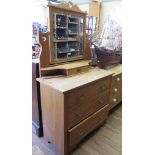 An Edwardian pine dressing chest, the swing mirror over three long graduated drawers, 91 cm wide,