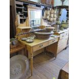 An Edwardian pine dressing table, the swing mirror and shelves over two frieze drawers on ring