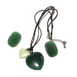 A pair of jade earrings and matching pendant