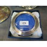 A round silver photo frame