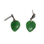 A pair of green jade earrings in the form of leaves