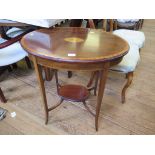 An Edwardian mahogany and satinwood crossbanded oval window table, the top with central patera motif