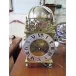An 18th century brass lantern clock, the rose engraved dial inscribed John Watts Stamford, with
