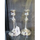 A pair of silver waisted candlesticks, Chester 1927, 15.5 cm high