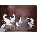 Two Nao figures of white geese looking back, a Lladro long neck goose and four other bird