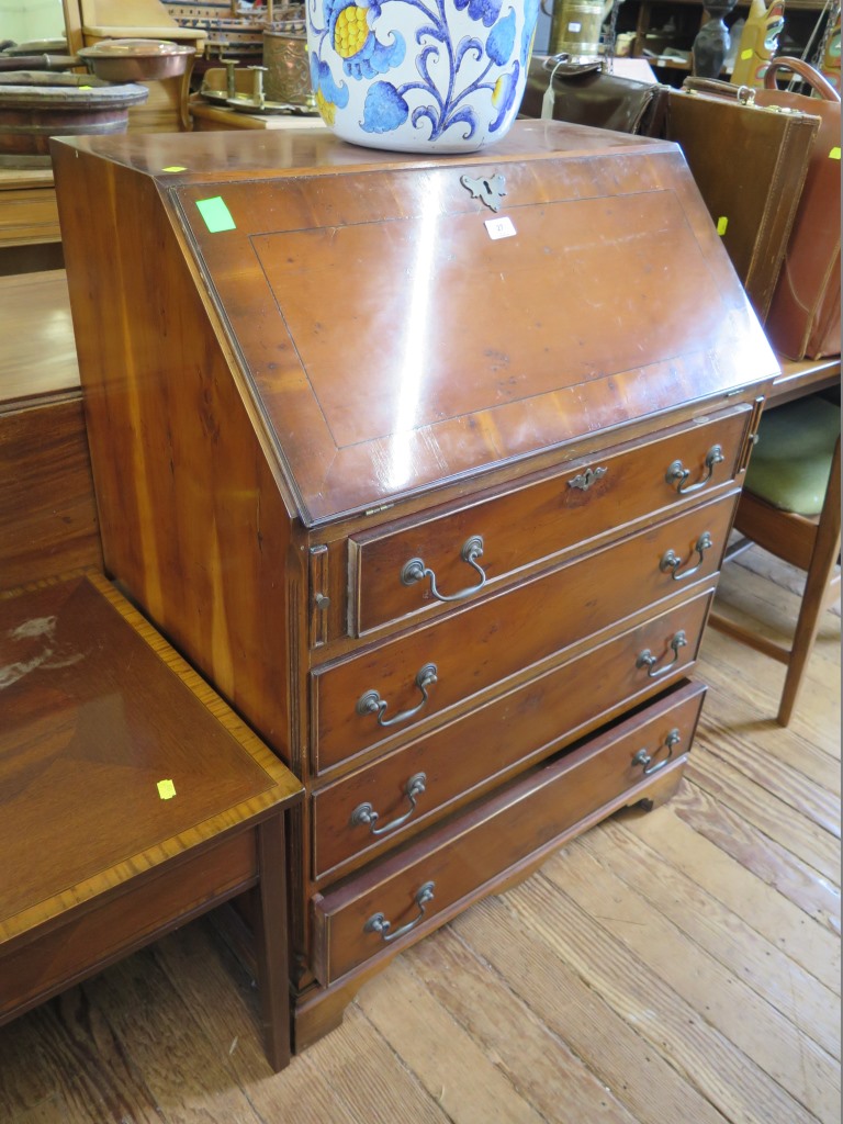 Two reproduction crossbanded coffee tables, 114 and 105 cm wide, and a yew wood reproduction