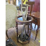 An Edwardian mahogany umbrella stand, cylindrical with ring turned supports, 37 cm diameter, 70 cm