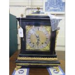 A George II style ebonised and gilt-metal bracket clock, the matted brass dial with scroll spandrels