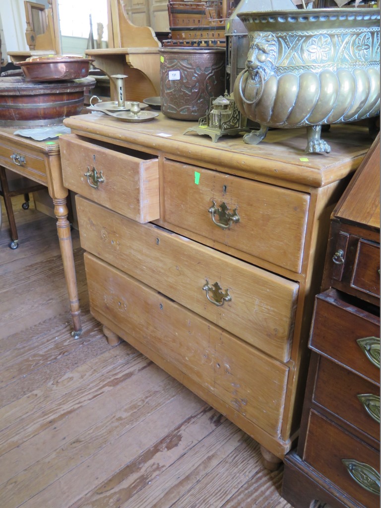 A Victorian pine chest of drawers, with two short and two long graduated drawers, with brass handles