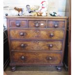 A walnut chest of drawers, with three short and three long graduated featherbanded drawers, on