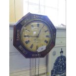 A Victorian rosewwod and brass inlaid octagonal wall clock, the painted dial inscribed Fehrenbach