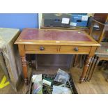 An Edwardian mahogany leather top writing table, with two frieze drawers on ring turned legs, 95