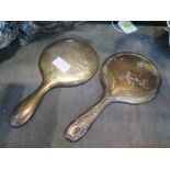 Two silver mounted ladies hand mirrors